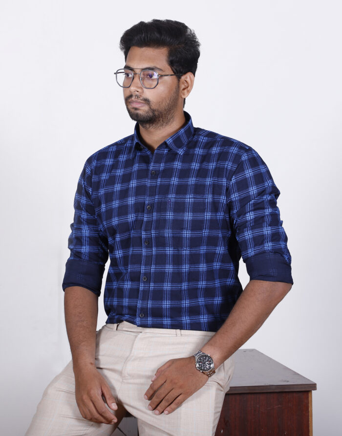 Men wearing a blue slim fit solid full sleeves casual shirt, showcasing a stylish and comfortable look.